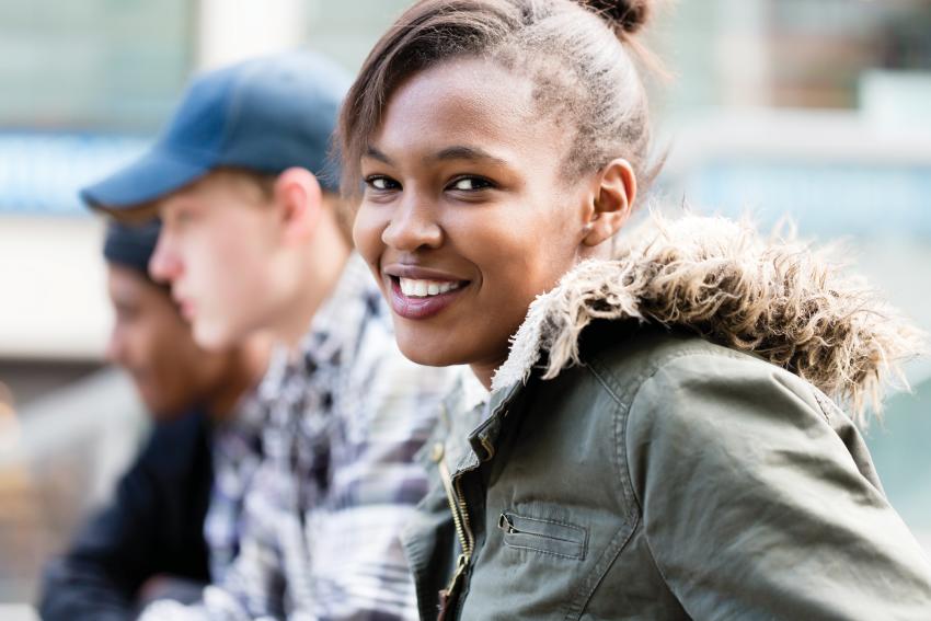 Teen girl smiling. Children's Wisconsin mental health resources for teens.