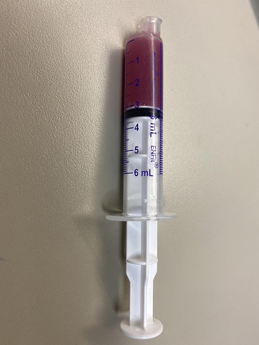 A syringe to be used for giving medicine but usually is not covered by insurance