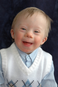 Photo of smiling boy wearing a vest