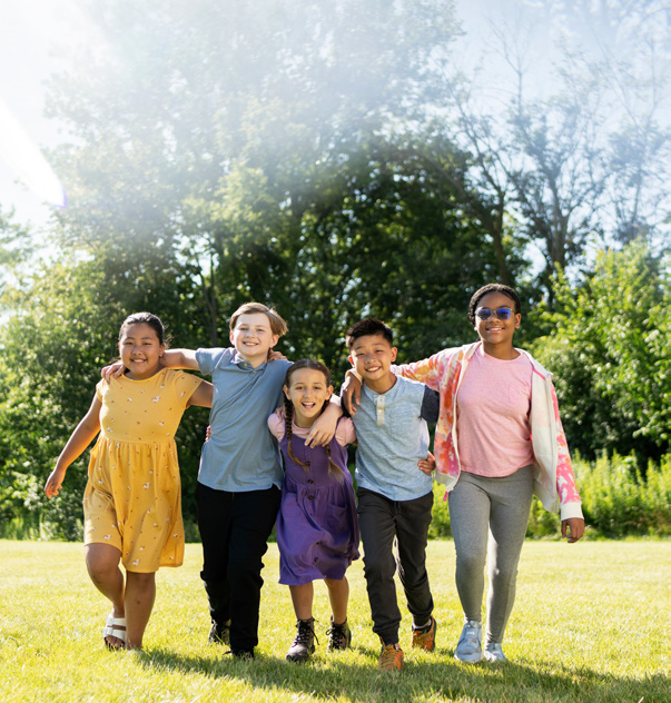Smiling kids arms around each other
