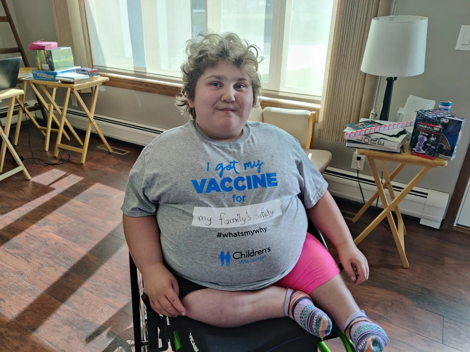 Namine posing in her hashtag what's my why t-shirt. Written in the blank space is my family's safety.