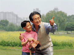 Asian grandfather with grandkid with baseball equipment