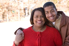 Mom and son smiling for a photo