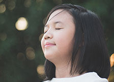 Girl practicing mindfulness outside