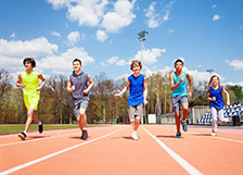 Kids running on race track