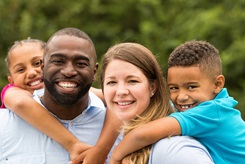 Kids playing with parents outside