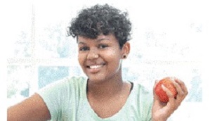 Teenage girl holding an apple