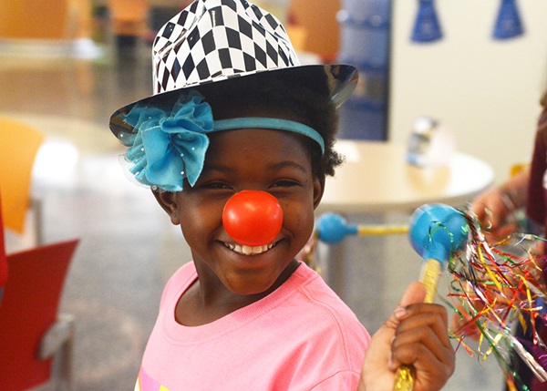 Girl with clown nose