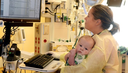 Nurse holding baby