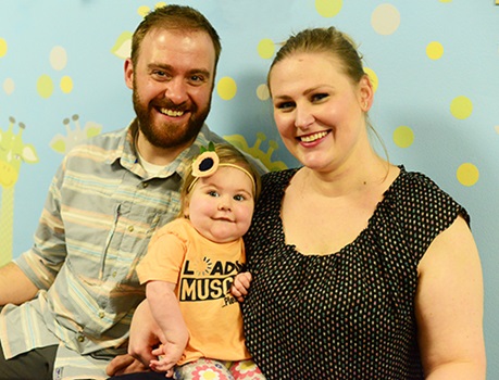 Lucy with her mom and dad