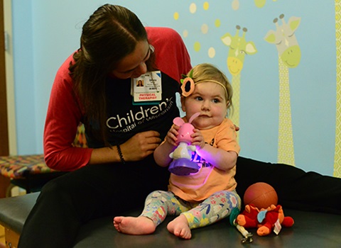 Lucy getting therapy from Children's Wisconsin therapist