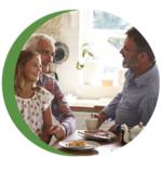 Two adults and a child talking and smiling